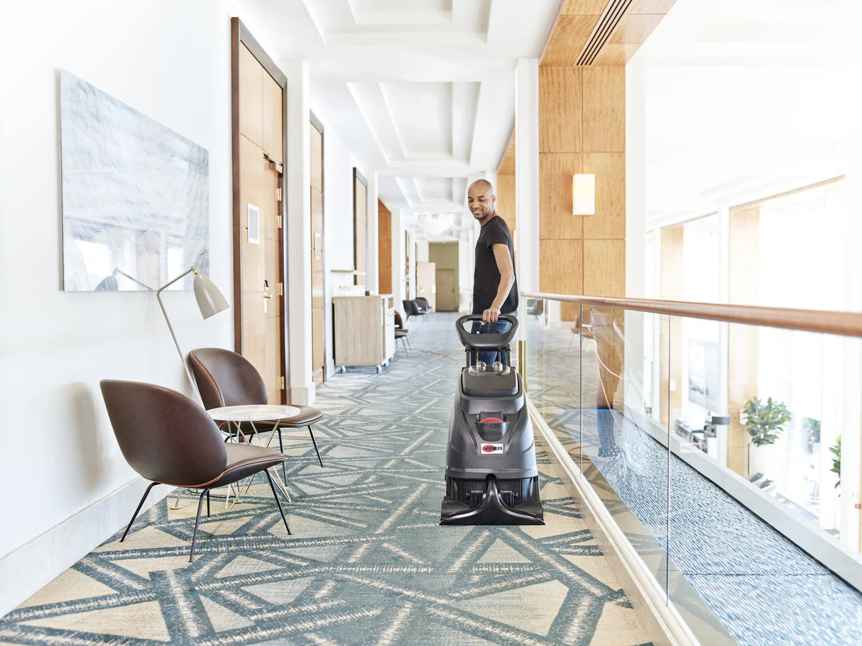 Viper CEX410 Carpet Extraction Machine in a hotel hallway, being operated by a worker.