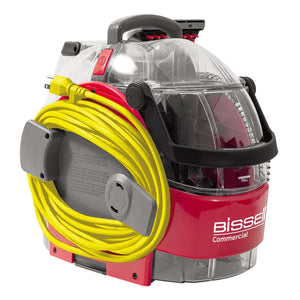 Bissell SC100 Carpet Spot Machine – compact carpet and upholstery spot cleaner with yellow power cord.