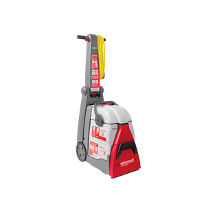 Bissell DC100 Compact Carpet Cleaner – portable cleaner with upholstery kit and safety labels.