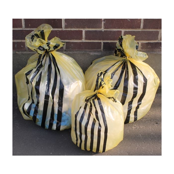 Yellow Tiger Stripe Clinical Waste Sacks 30L x1000, stacked and tied for waste disposal.