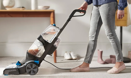 Vax Platinum SmartWash Carpet Cleaner in use on a carpeted floor.