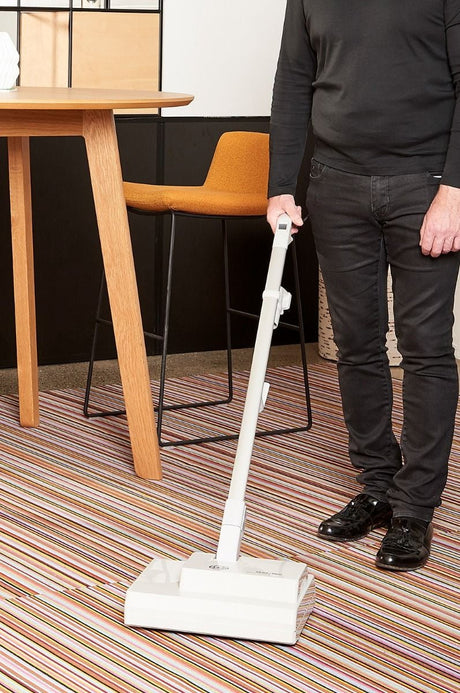 Sebo Duo-P Dry Carpet Machine 3000G in use on striped carpet.