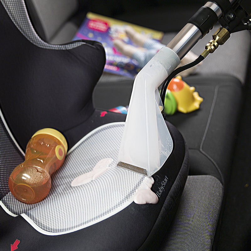 Numatic HVW370‑2 Henry Wash – professional carpet and upholstery extraction cleaner in use on a car seat.
